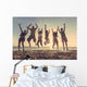 Multiracial group of people jumping at beach Wall Mural