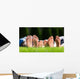 Family relaxing on the grass Wall Mural