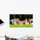 Family relaxing on the grass Wall Mural