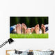 Family relaxing on the grass Wall Mural