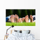 Family relaxing on the grass Wall Mural