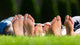 Family Relaxing On The Grass Wall Decal