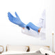 Doctor putting on sterile gloves isolated on white Wall Decal