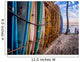 Colourful surfboards stacked up on Waikiki Beach at sunset. Wall Mural
