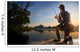 Young man fishing at misty sunrise Wall Mural