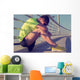 Tired/injured jogger on a big bridge. Wall Mural