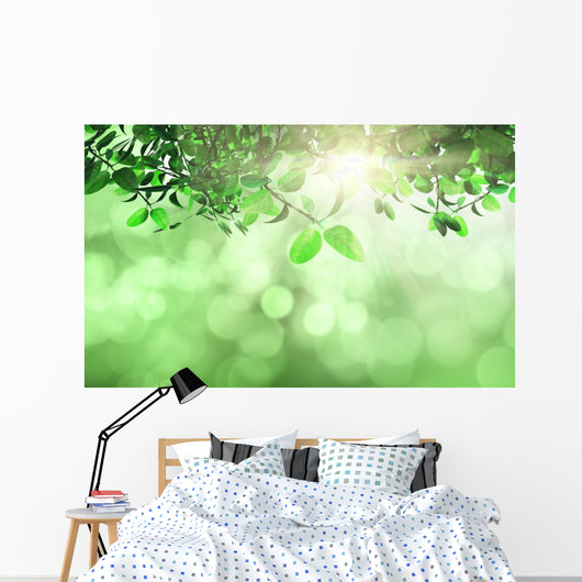 Leaves and grass against a defocussed background Wall Mural