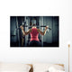 Sports background. Muscular fit woman exercising. Wall Mural