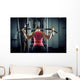 Sports background. Muscular fit woman exercising. Wall Mural