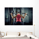 Sports background. Muscular fit woman exercising. Wall Mural