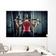 Sports background. Muscular fit woman exercising. Wall Mural