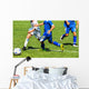 Young soccer players in action Wall Mural