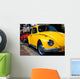 A Vintage Red and Yellow  Volkswagen Beetle Parked Wall Mural