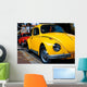 A Vintage Red and Yellow  Volkswagen Beetle Parked Wall Mural