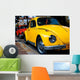 A Vintage Red and Yellow  Volkswagen Beetle Parked Wall Mural
