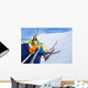 Little skier boy with mother lift on mountain Wall Mural