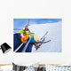Little skier boy with mother lift on mountain Wall Mural