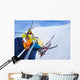 Little skier boy with mother lift on mountain Wall Mural