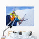 Little skier boy with mother lift on mountain Wall Mural