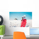 Woman explorer skier looking the snowy horizon Wall Mural