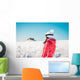 Woman explorer skier looking the snowy horizon Wall Mural