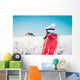 Woman explorer skier looking the snowy horizon Wall Mural
