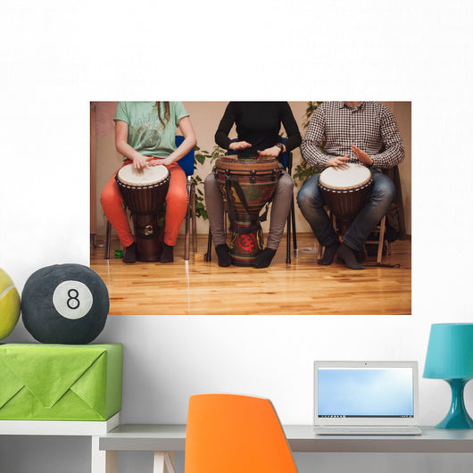 Group of Jambe drummers playing Wall Mural