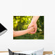 father holding  daughter hand Wall Mural