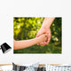 father holding  daughter hand Wall Mural