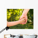 father holding  daughter hand Wall Mural