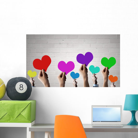 Holding Rainbow Hearts Wall Mural