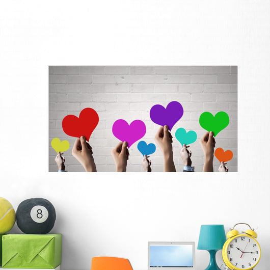 Holding Rainbow Hearts Wall Mural