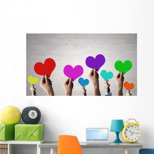 Holding Rainbow Hearts Wall Mural
