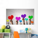 Holding Rainbow Hearts Wall Mural