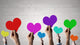 Holding Rainbow Hearts Wall Decal