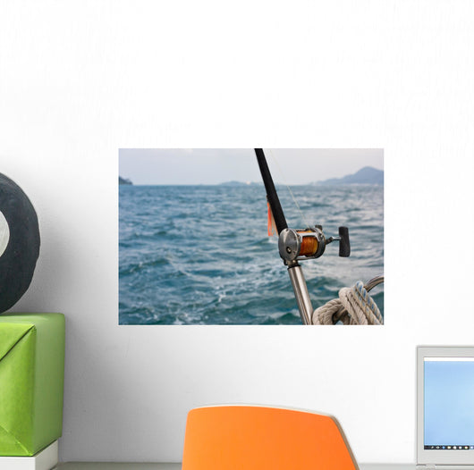 Fishing rod and reel on a boat Wall Mural
