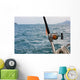 Fishing rod and reel on a boat Wall Mural