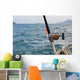 Fishing rod and reel on a boat Wall Mural
