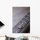 Guitar frets with strings and mediator on dark brown surface Wall Mural