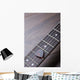 Guitar frets with strings and mediator on dark brown surface Wall Mural