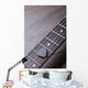 Guitar frets with strings and mediator on dark brown surface Wall Mural