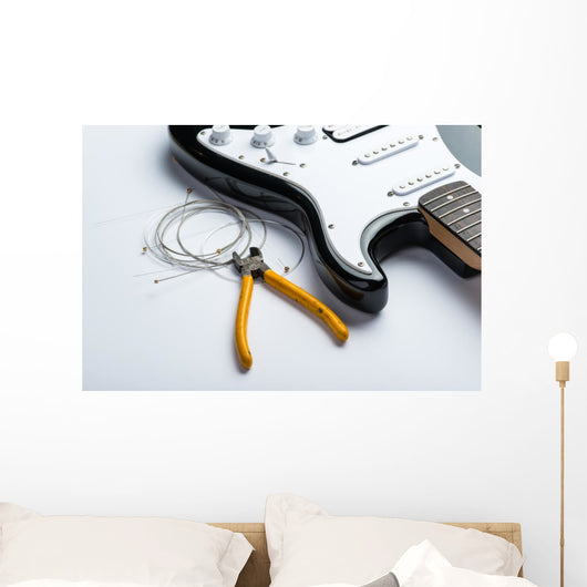 Electric guitar with yellow nippers and strings Wall Mural