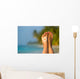 Woman foot with sun-shaped sun cream in the tropical beach Wall Mural