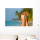 Woman foot with sun-shaped sun cream in the tropical beach Wall Mural