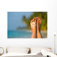 Woman foot with sun-shaped sun cream in the tropical beach Wall Mural