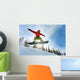 Snowboarder jumping Wall Mural