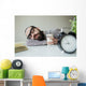 Man sleeps in office on table over laptop with coffee in hand Wall Mural