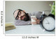 Man sleeps in office on table over laptop with coffee in hand Wall Mural
