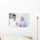 Doctor explaining prescription to senior patient Wall Mural