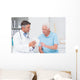 Doctor explaining prescription to senior patient Wall Mural